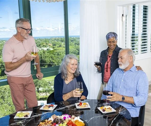 Senior friends eating dinner at senior living community in Florida.