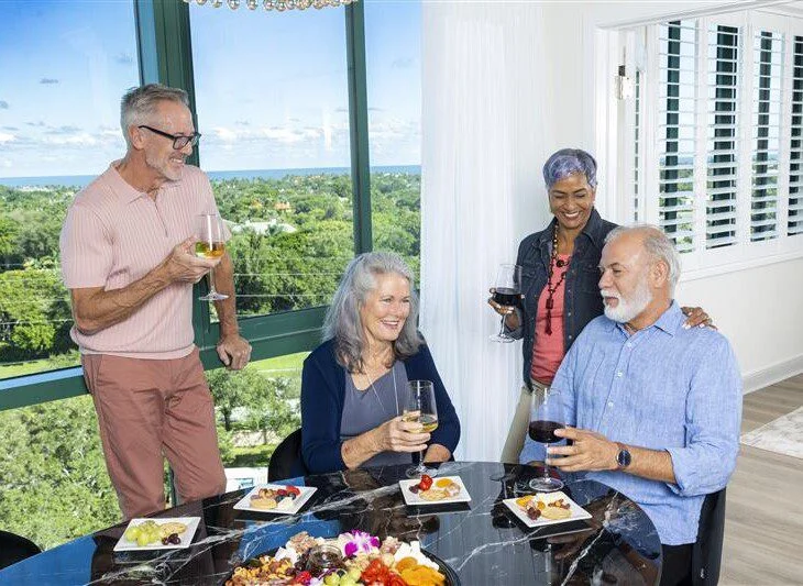 Senior friends eating dinner at senior living community in Florida.