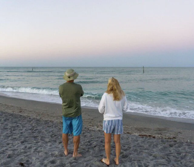 Seniors enjoying the beach located near their coastal senior living community.