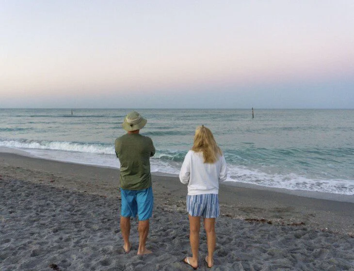 Seniors enjoying the beach located near their coastal senior living community.
