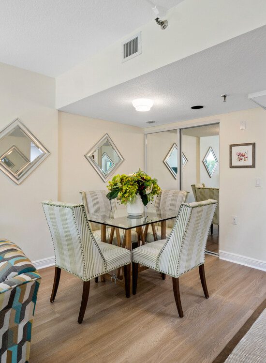 Dinning table and front door in a senior apartment at The Waterford senior living community