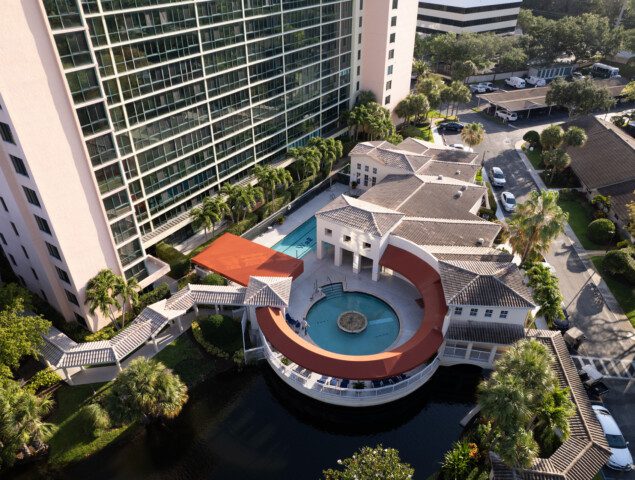 An aerial view of a a round pool and lounge area