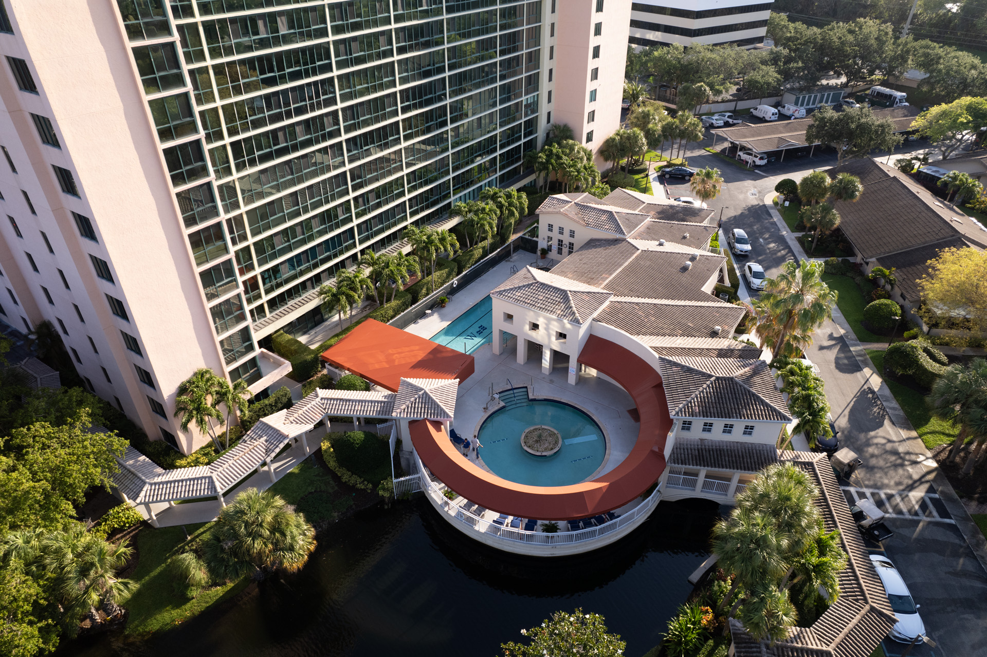 An aerial view of a a round pool and lounge area