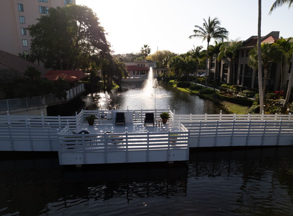 An aerial view overlooking a bridge and water feature