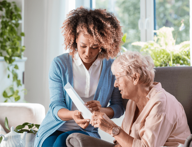 A senior woman talking to her waterford caretaker