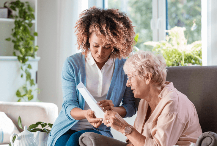 A senior woman talking to her waterford caretaker