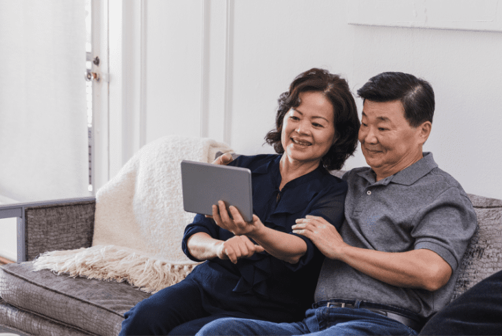 A senior couple looking at a tablet