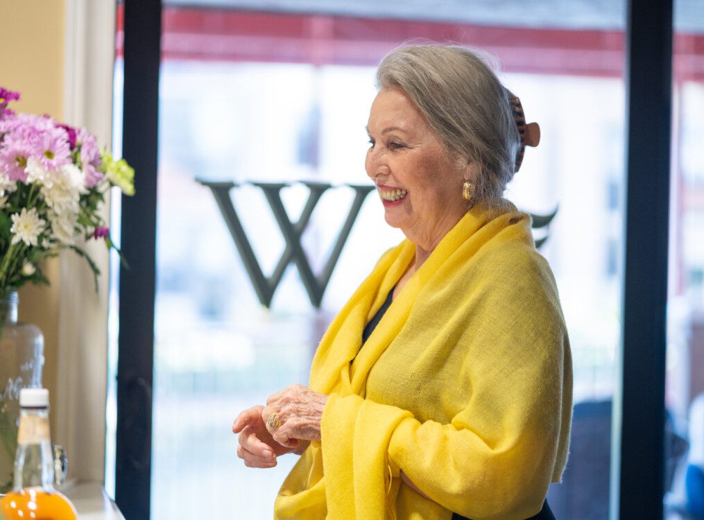 A senior woman standing