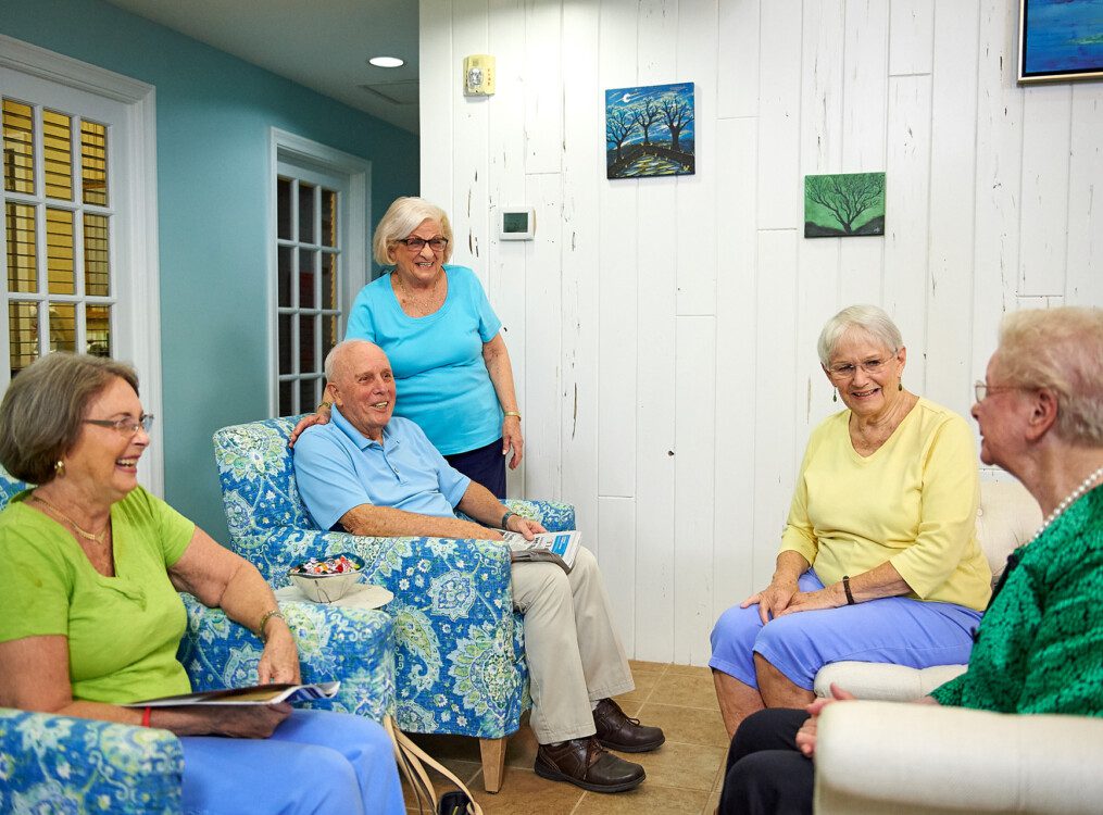 A group of seniors sitting together and laughing