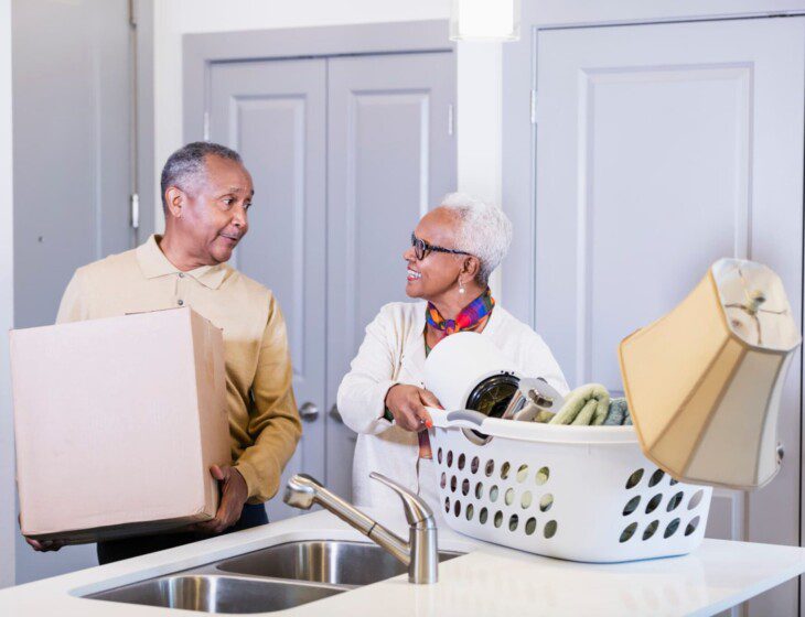A senior couple moving into a Waterford senior living apartment
