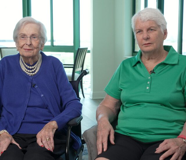 screenshot from video of Oak Trace residents Pat McDonald and Corrin Gouldy seated for an interview