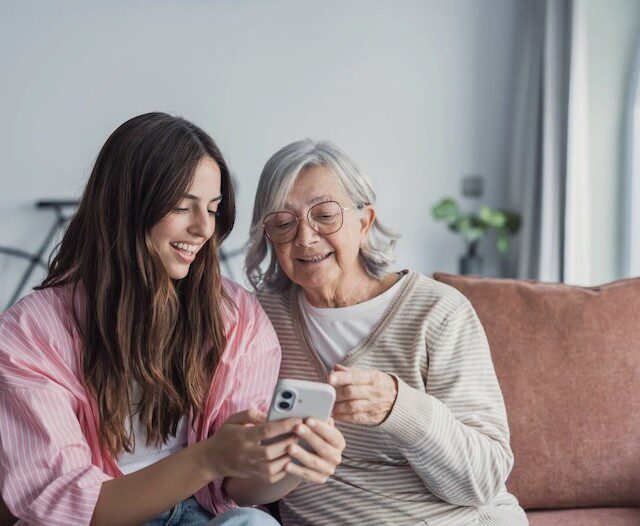 Adult daughter and senior mother discuss senior living options 