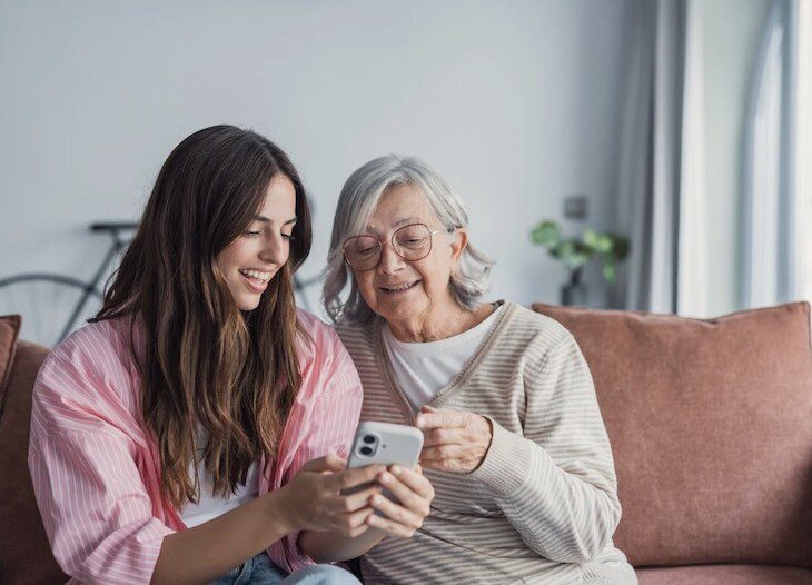 Adult daughter and senior mother discuss senior living options 
